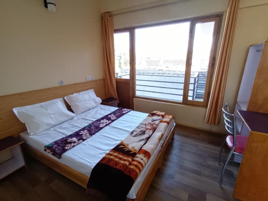 Letto o letti in una camera di Gonbo Guest House