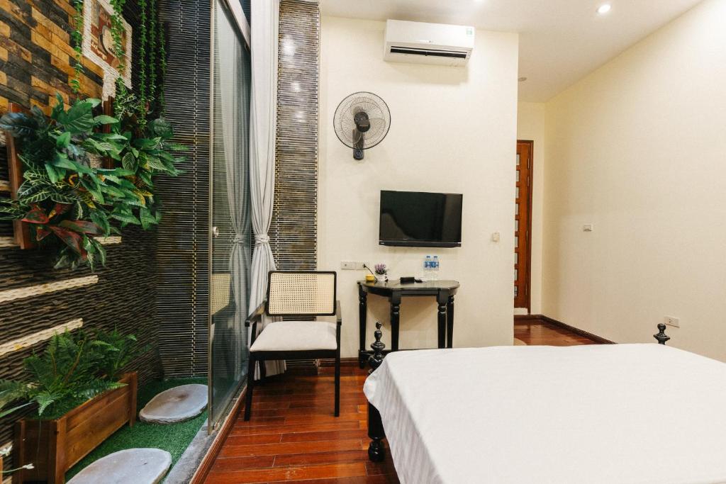 TV a/nebo společenská místnost v ubytování Sun Clover Boutique Hotel