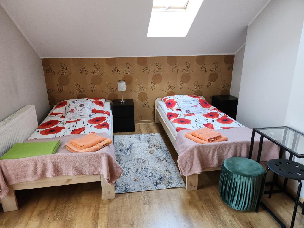 Posteľ alebo postele v izbe v ubytovaní Apartament Wega