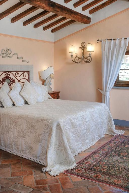 Łóżko lub łóżka w pokoju w obiekcie Il Falconiere Relais & Spa