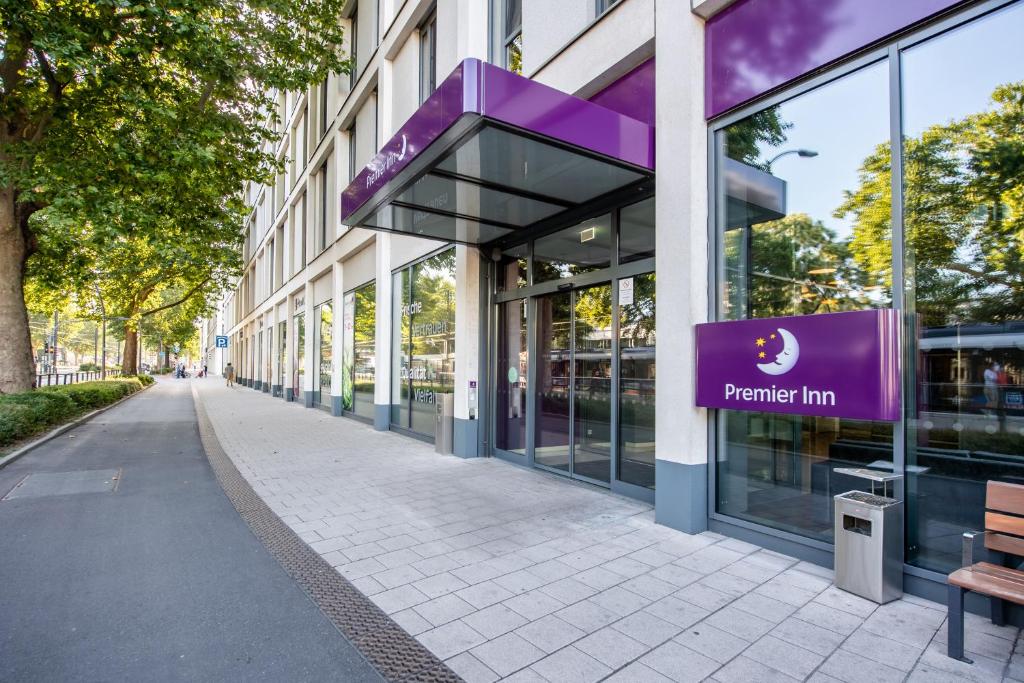 a purple sign on the side of a building at Premier Inn Heidelberg City Centre in Heidelberg