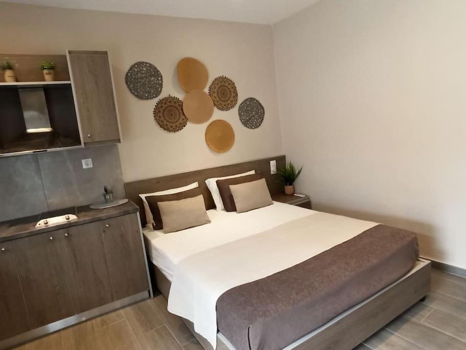 a bedroom with a large bed in a room at achlia beach apartments 1 in Ierapetra