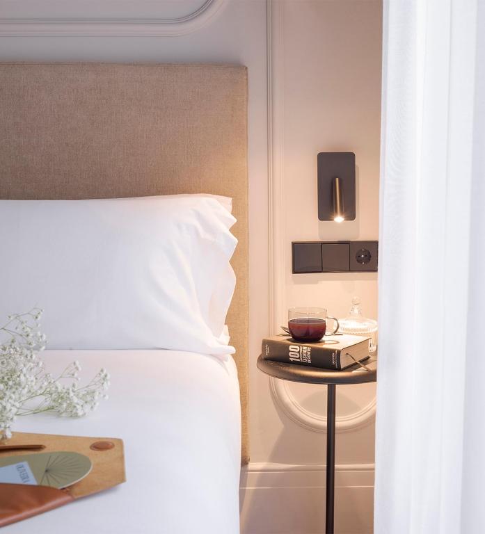 Postel nebo postele na pokoji v ubytování Oliveira Rooms