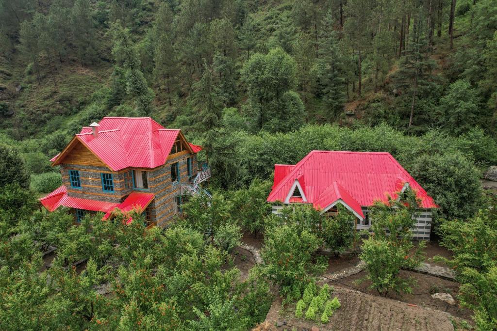 an aerial view of a house with red roof at SaffronStays The Elements in Kulu