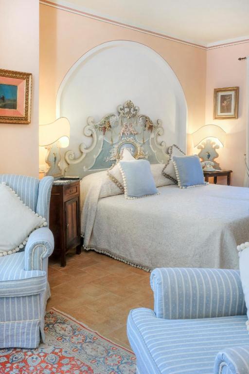 Łóżko lub łóżka w pokoju w obiekcie Il Falconiere Relais & Spa