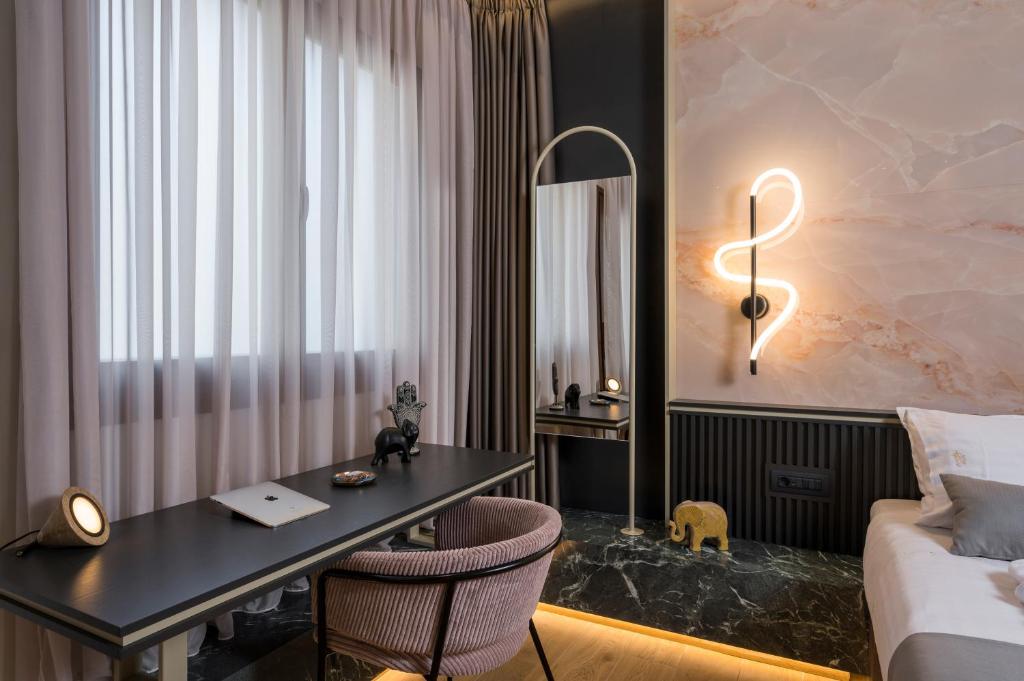 Łóżko lub łóżka w pokoju w obiekcie Agave Suites