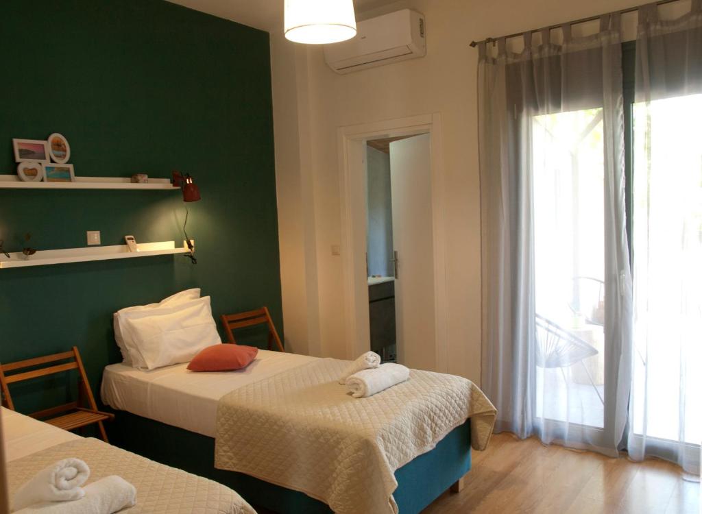 A bed or beds in a room at Chania Olive Home