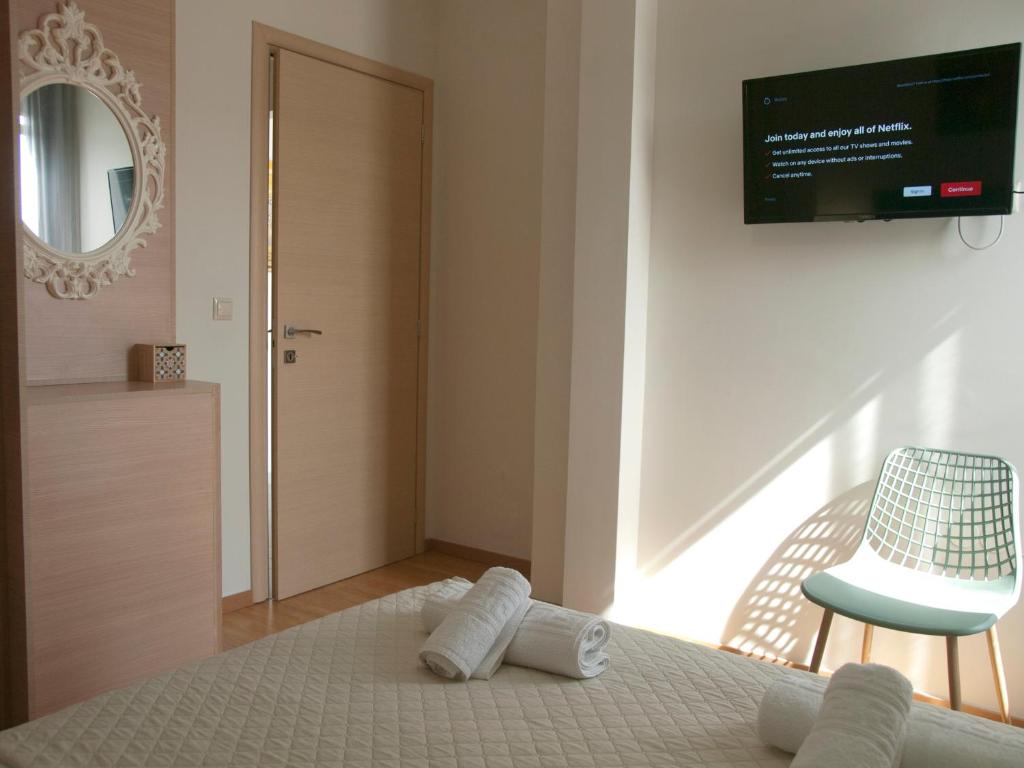 A bed or beds in a room at Chania Olive Home