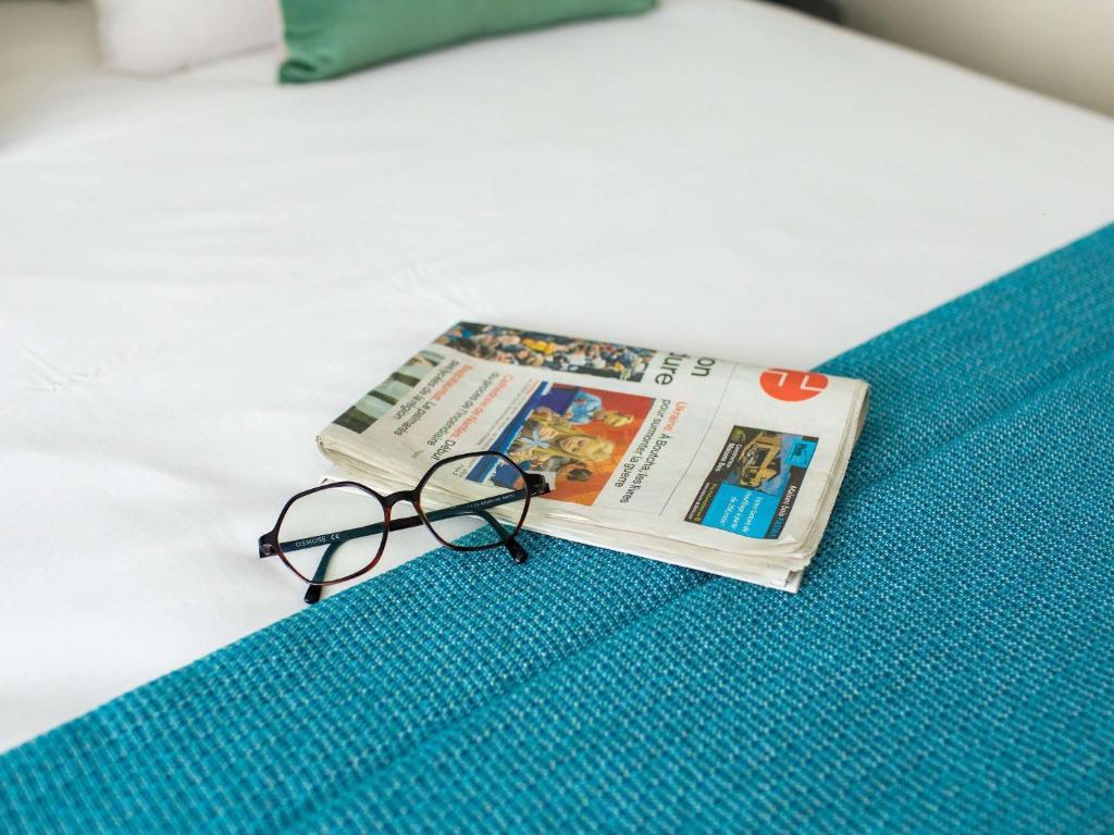 Postel nebo postele na pokoji v ubytování Mercure Lorient Centre