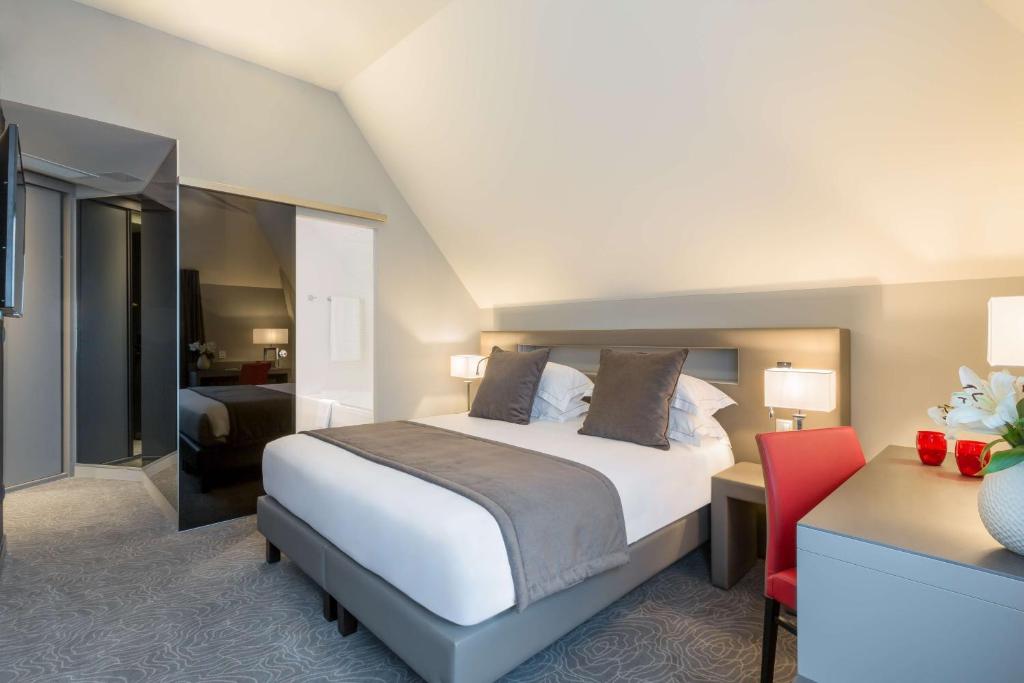 Postel nebo postele na pokoji v ubytování Best Western Plus Le Moderne