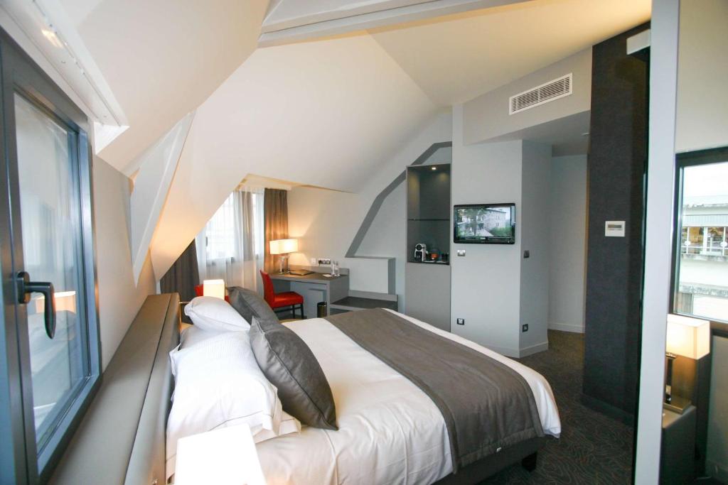 Postel nebo postele na pokoji v ubytování Best Western Plus Le Moderne