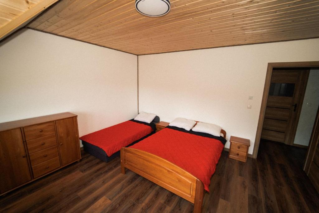 Posteľ alebo postele v izbe v ubytovaní Wilki2