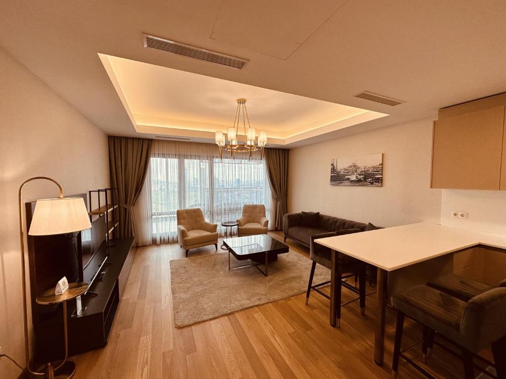 a living room with a couch and a table at Maslak Aparts in Istanbul