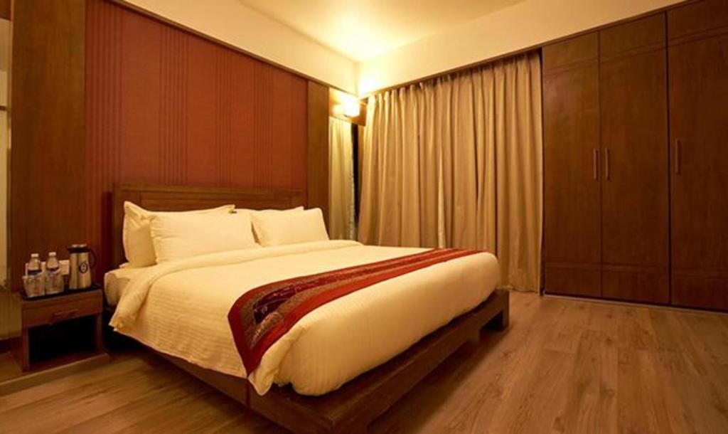 Postel nebo postele na pokoji v ubytování Hotel Prime Ivy Studio