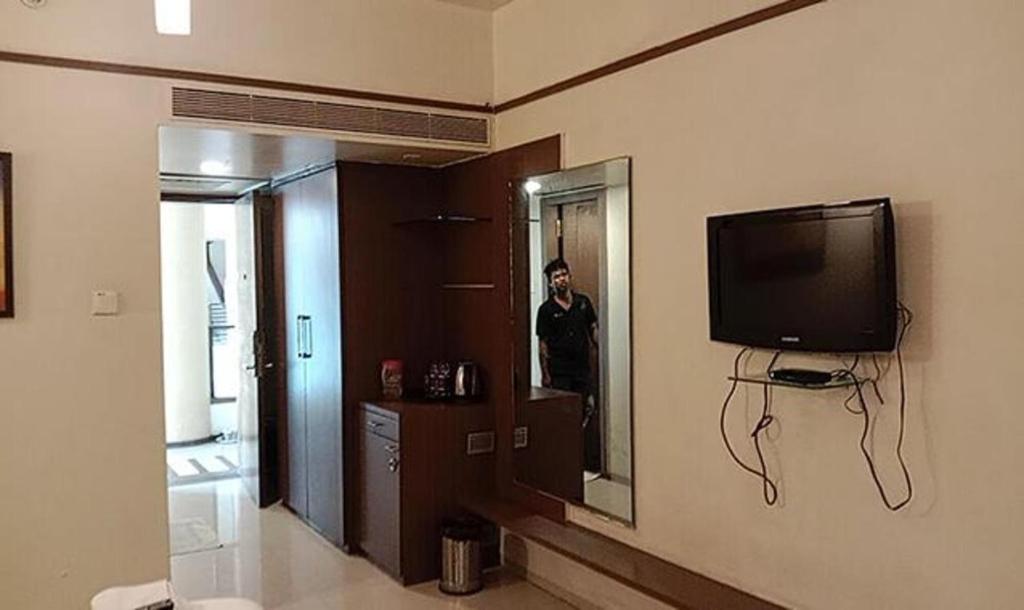 TV a/nebo společenská místnost v ubytování Hotel Prime Ivy Studio
