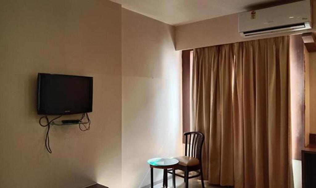 TV a/nebo společenská místnost v ubytování Hotel Prime Ivy Studio