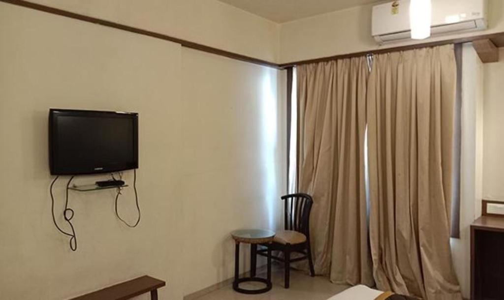 TV a/nebo společenská místnost v ubytování Hotel Prime Ivy Studio