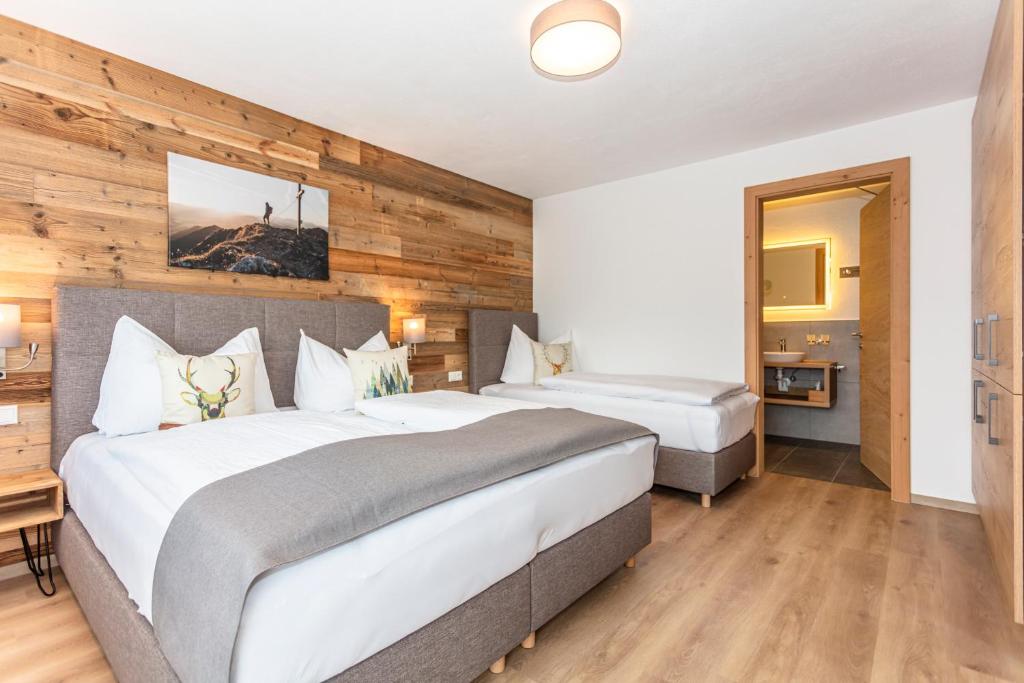 Postel nebo postele na pokoji v ubytování Kaiser Apart Walchsee
