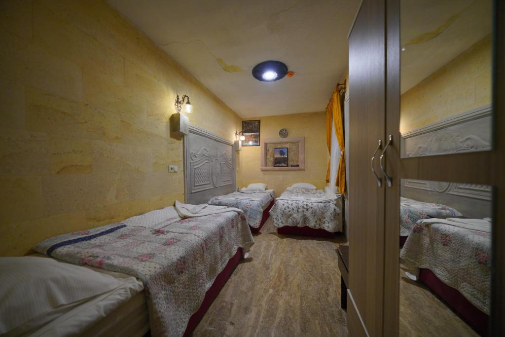 A bed or beds in a room at Lucky Luke Stone House