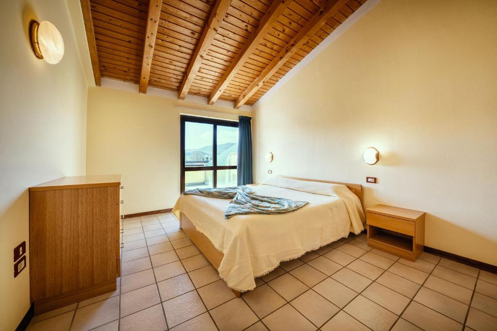 Postel nebo postele na pokoji v ubytování Hotel Residence Campi