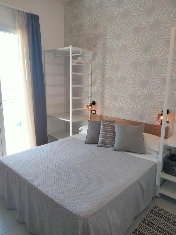 Postel nebo postele na pokoji v ubytování Albergo Aquila