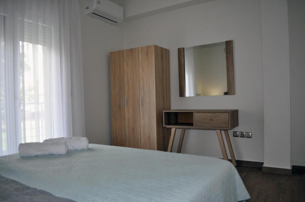 Postel nebo postele na pokoji v ubytování Thea Home