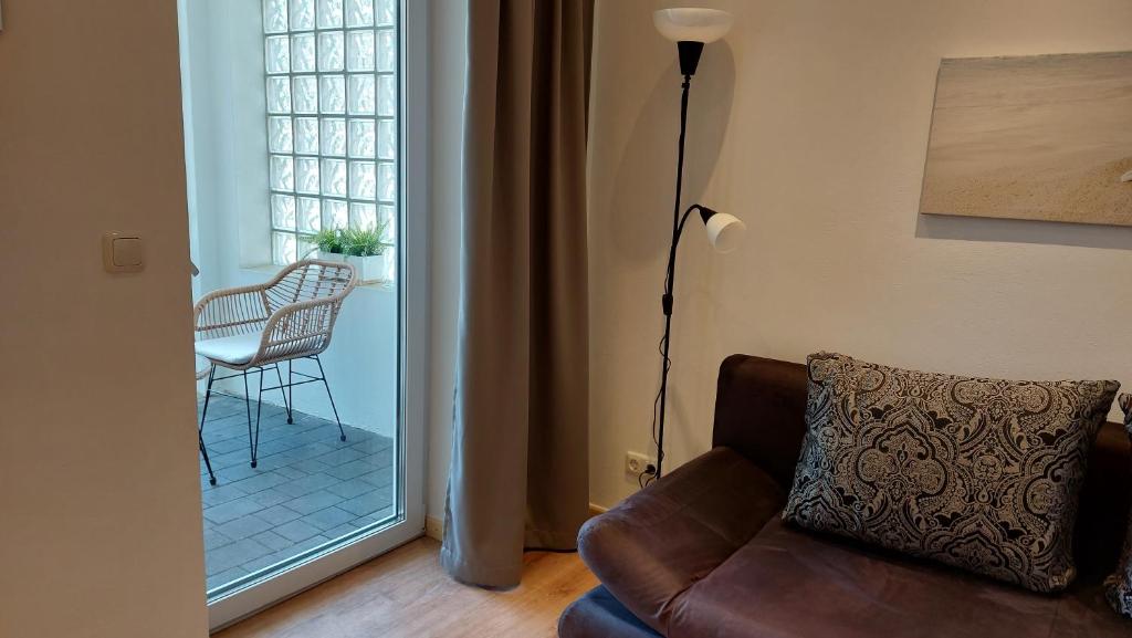 a living room with a couch and a window at Kleine Wohnung in Bad Schwartau in Bad Schwartau
