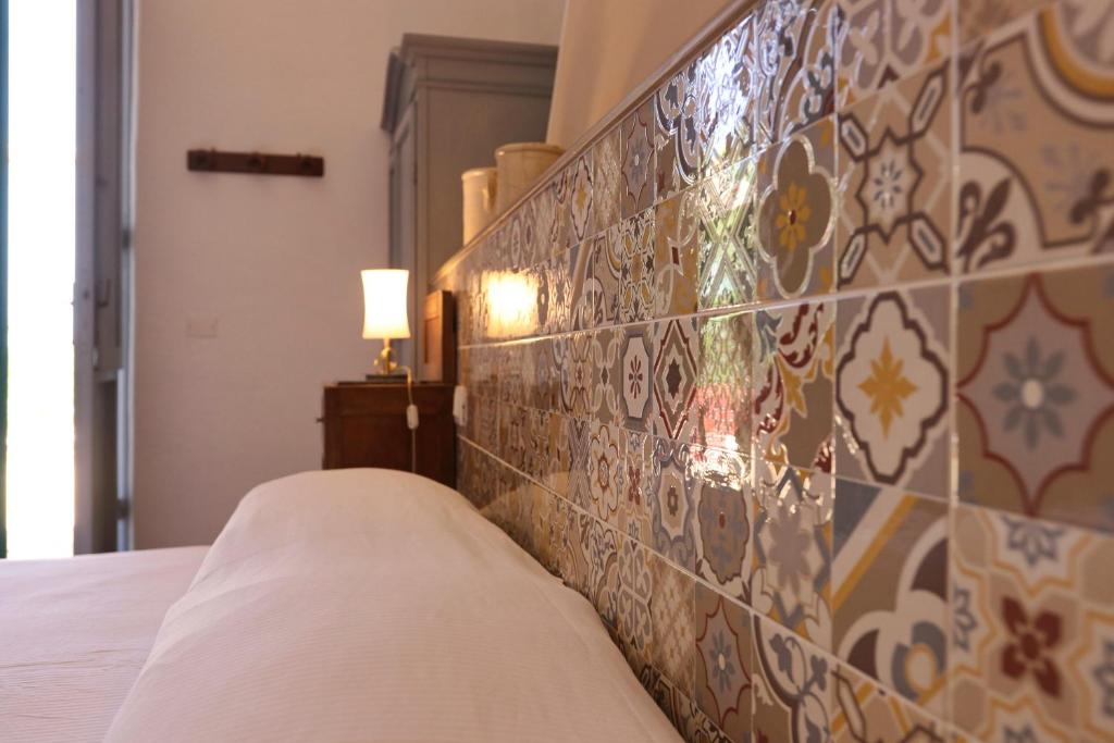 Postel nebo postele na pokoji v ubytování Masseria Trullo Sovrano Exclusive B&B
