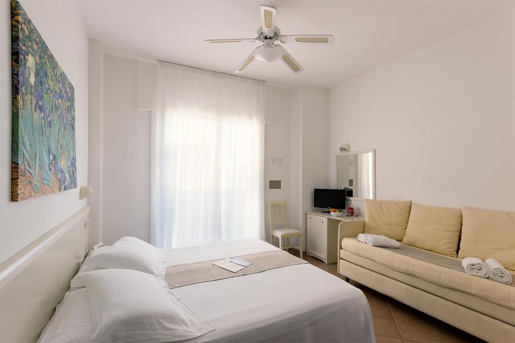 Postel nebo postele na pokoji v ubytování Trevi Family Resort