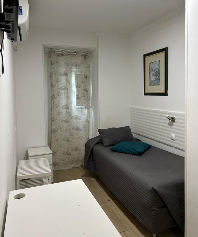 Postel nebo postele na pokoji v ubytování Residencial Joao XXI