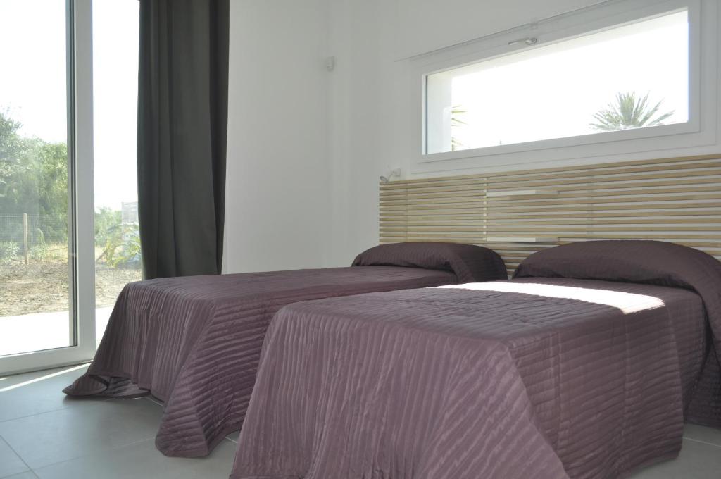 Łóżko lub łóżka w pokoju w obiekcie Casa Solà