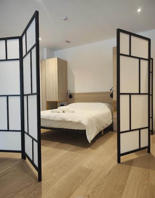 Posteľ alebo postele v izbe v ubytovaní Apartamentos Pillotegi parking gratuito