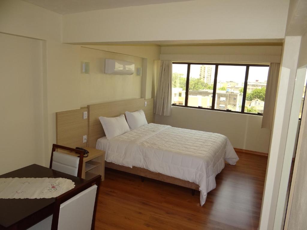 A bed or beds in a room at Hotel Almanara