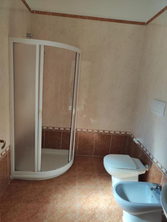 a bathroom with a shower and a toilet at Lovin Puglia Vacation in Bari