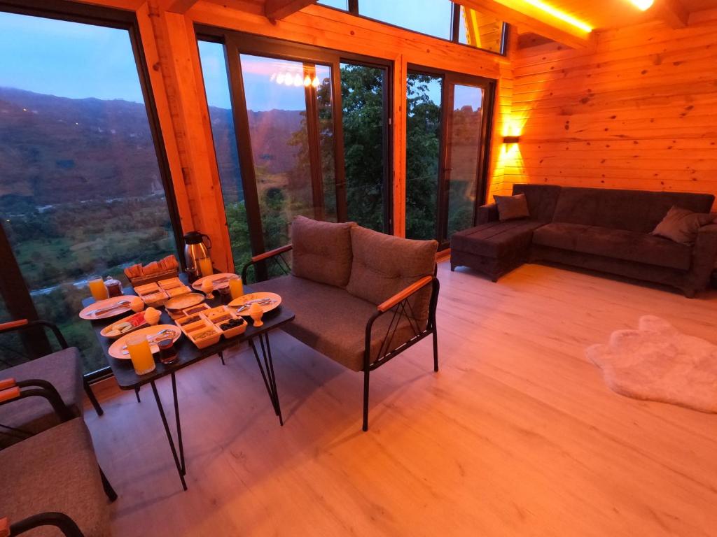 Posezení v ubytování Necran Bungalow اكواخ ايدر