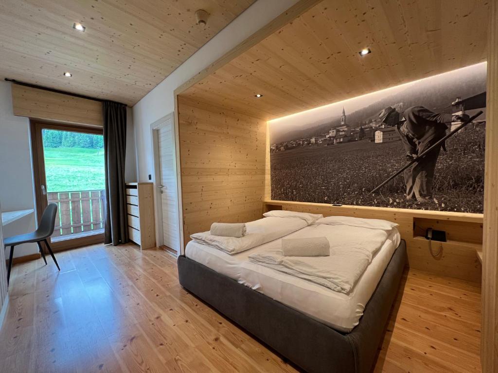 Postel nebo postele na pokoji v ubytování Hotel D'La Varda