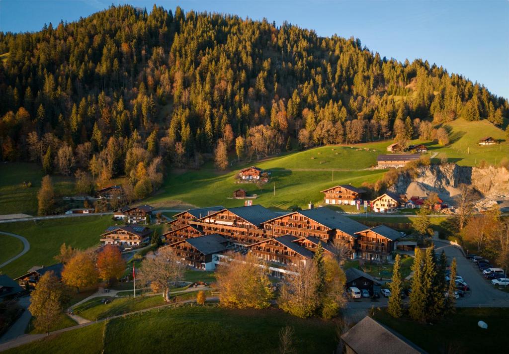 an aerial view of a resort in the mountains at HUUS Gstaad in Gstaad