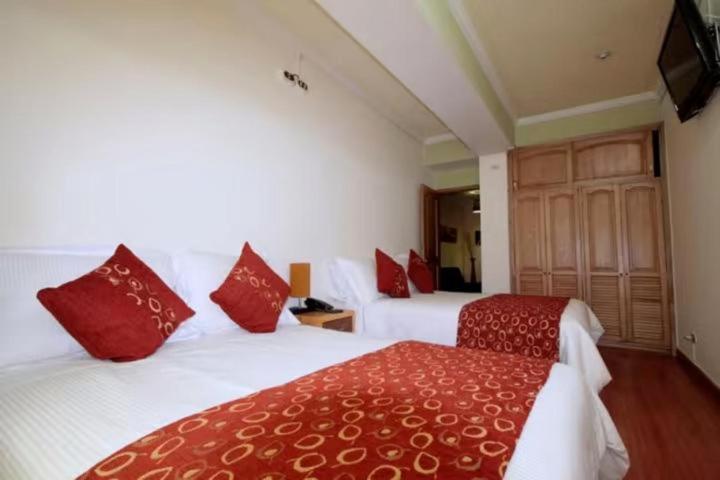 Ein Bett oder Betten in einem Zimmer der Unterkunft Hotel Airport Travel