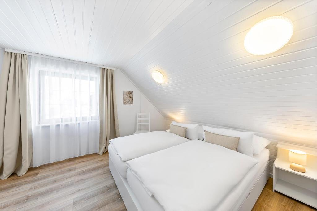 Postel nebo postele na pokoji v ubytování Landhaus Rust