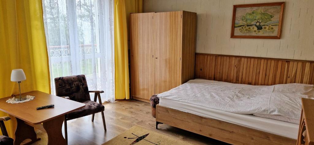 Postel nebo postele na pokoji v ubytování Dom Wczasowy Orka