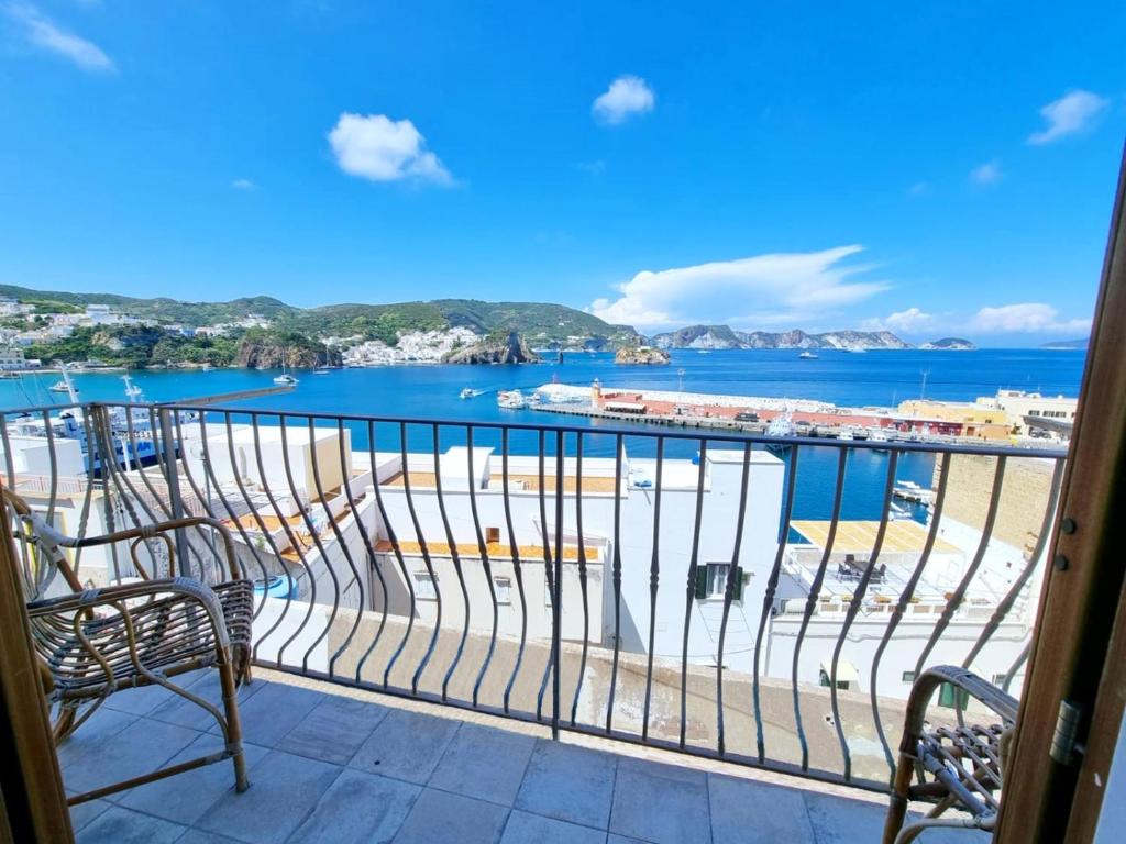 a balcony with chairs and a view of the ocean at Maridea - Corso Umberto in Ponza