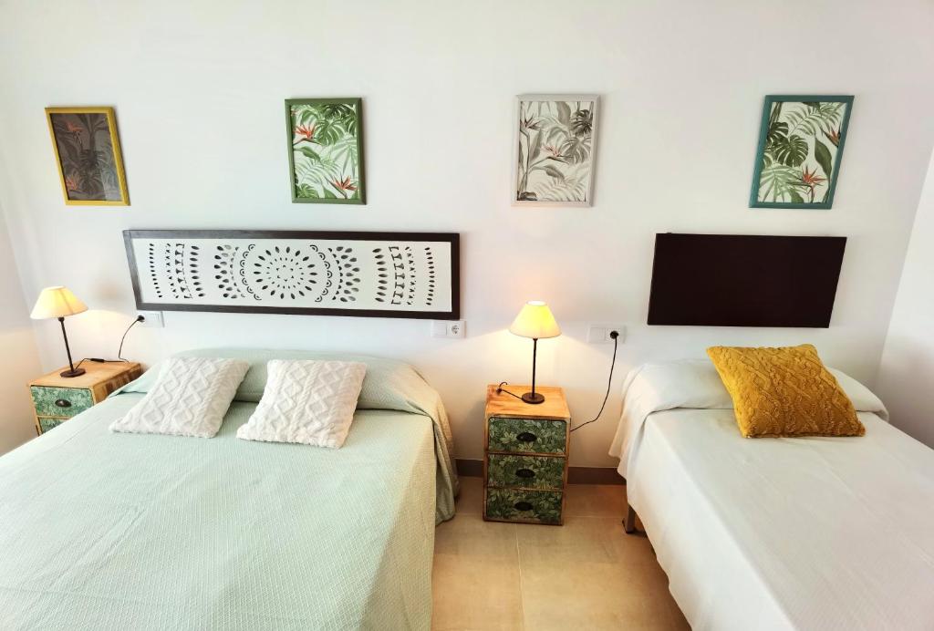 Postel nebo postele na pokoji v ubytování Hostal Noray