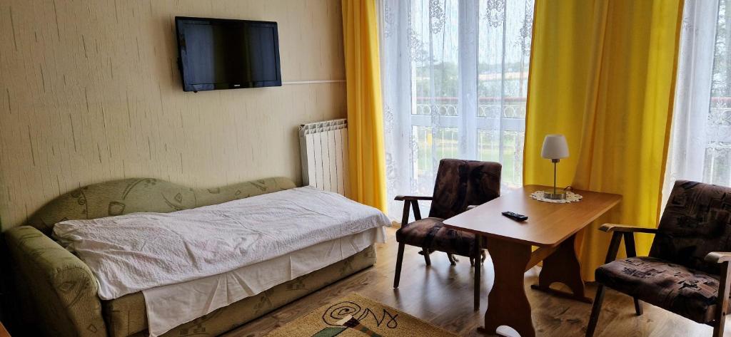 Postel nebo postele na pokoji v ubytování Dom Wczasowy Orka