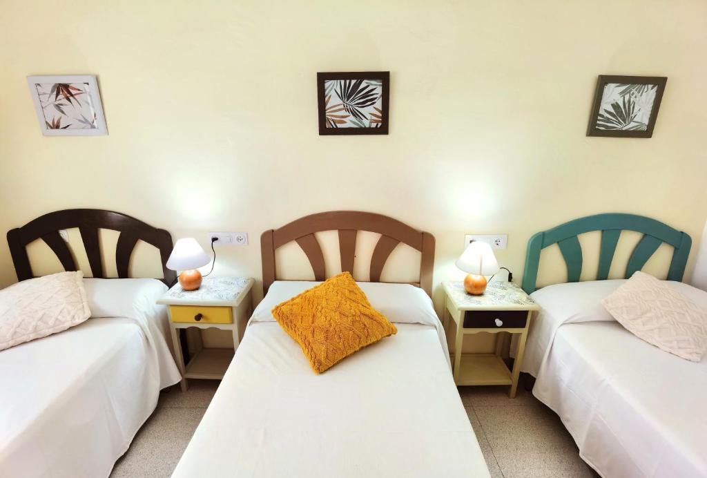Postel nebo postele na pokoji v ubytování Hostal Noray