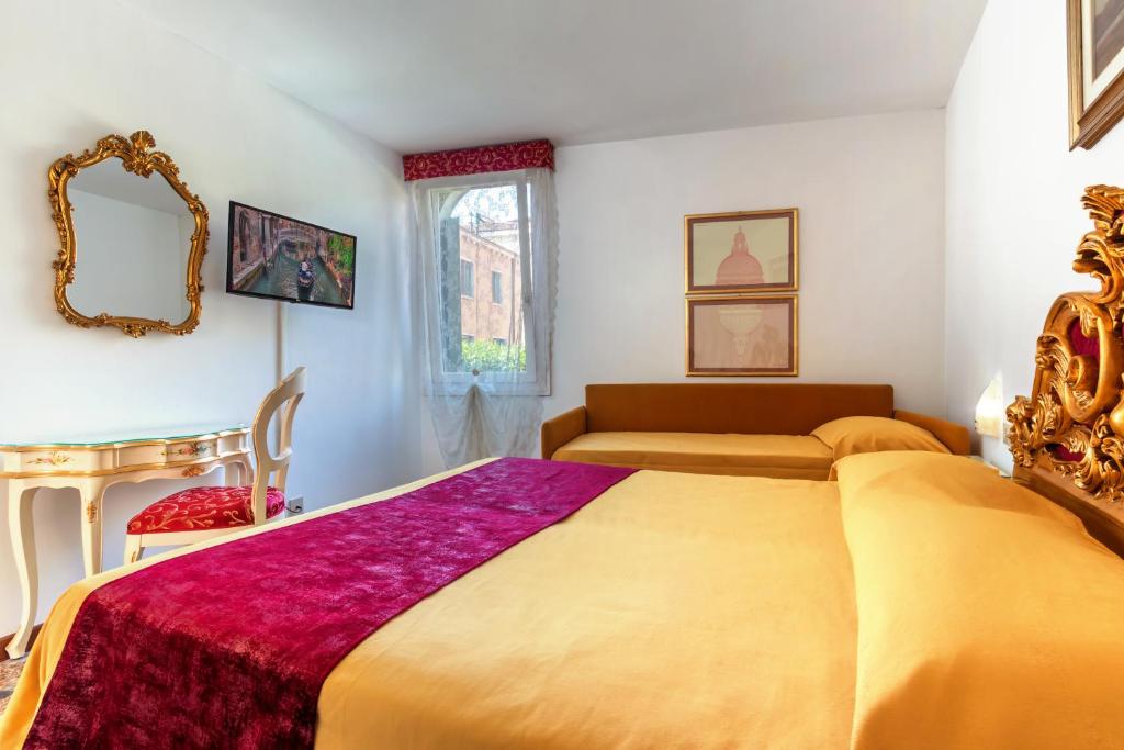 Postel nebo postele na pokoji v ubytování Hotel Casa Boccassini