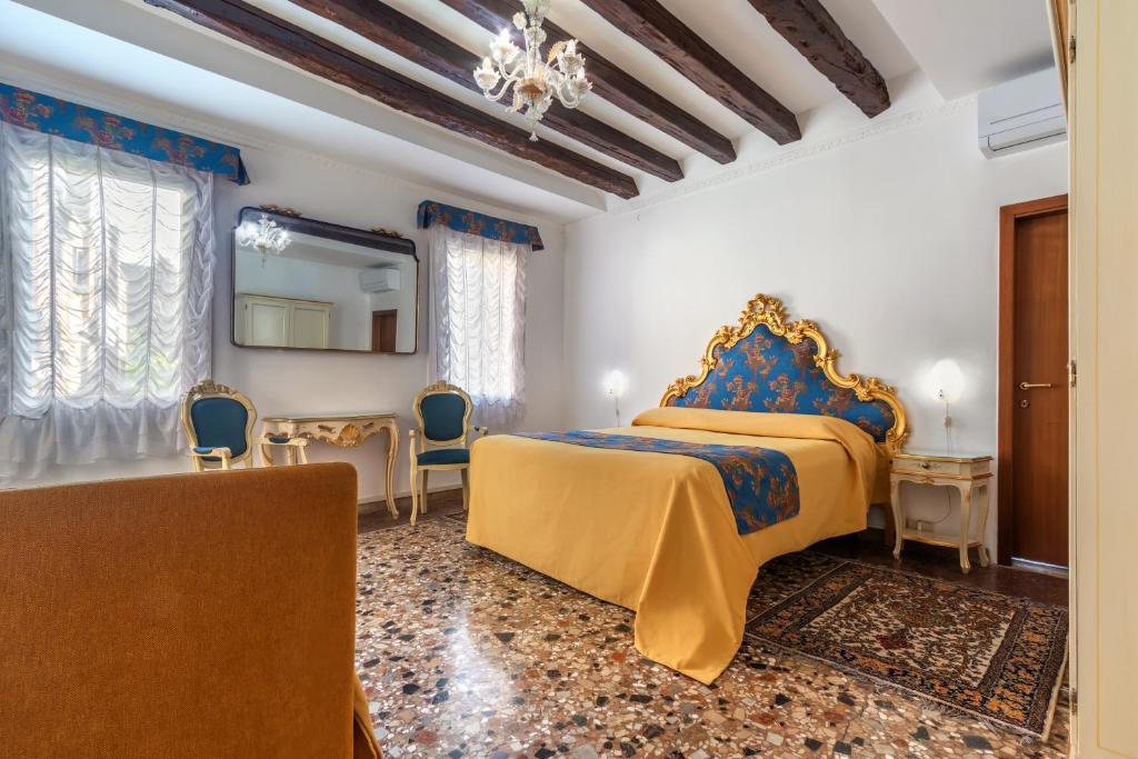 Postel nebo postele na pokoji v ubytování Hotel Casa Boccassini
