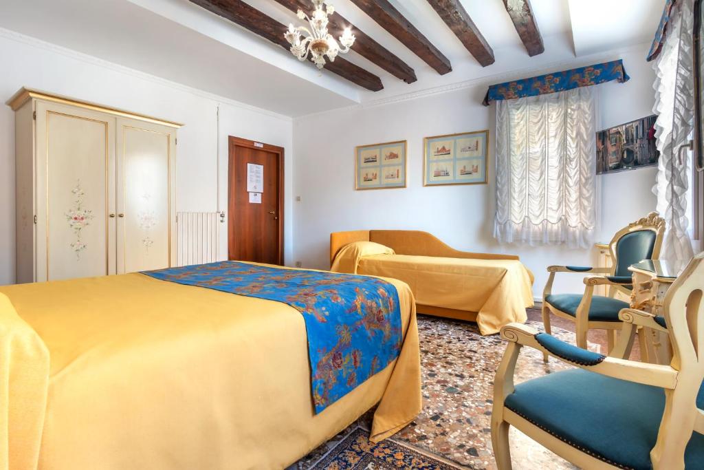 Postel nebo postele na pokoji v ubytování Hotel Casa Boccassini