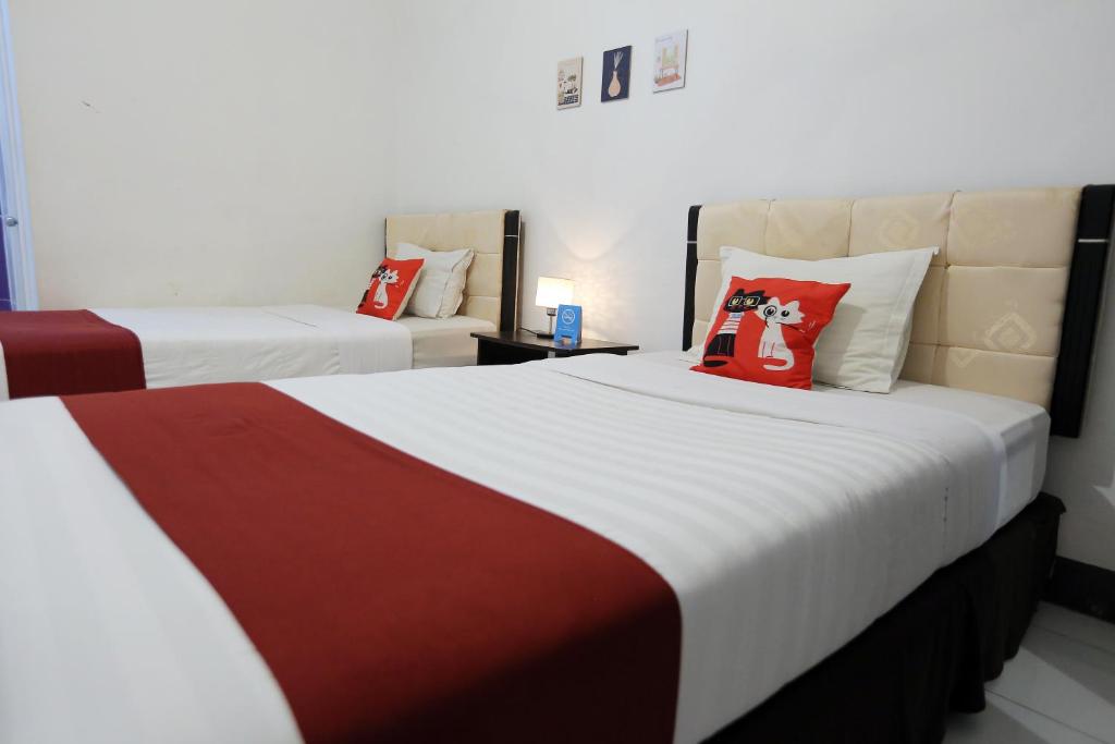 Gading Guest House客房内的一张或多张床位