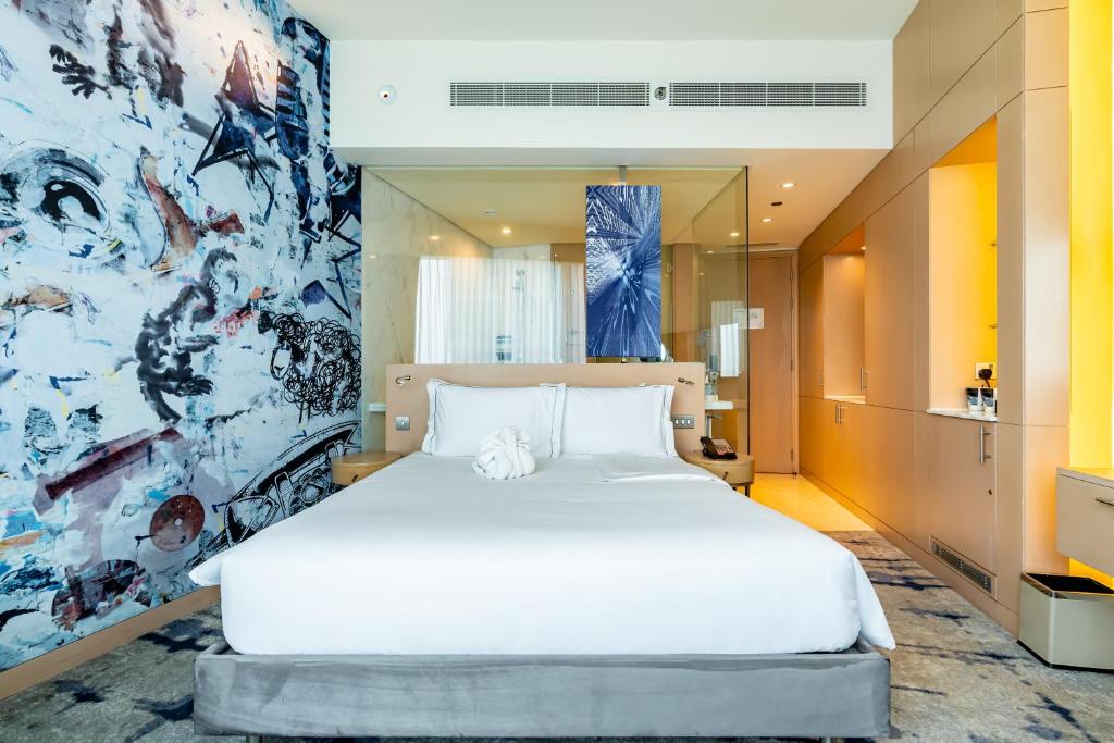 Postel nebo postele na pokoji v ubytování Media One Hotel