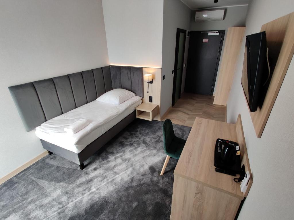 Postel nebo postele na pokoji v ubytování Nowe M4 Żyrardów Centrum - blisko Suntago